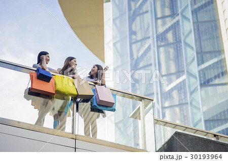 Adorable girls are talking together above the building. Adorable girls are talking together above the building. 30193964