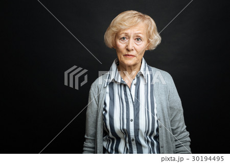 Pitiful aging woman demonstrating comparison Pitiful aging woman demonstrating comparison 30194495