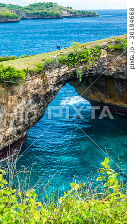 Stone arch over the sea. Broken beach. Rock 30194668