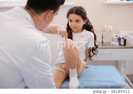 Cute nice girl pointing at her knee 30195411