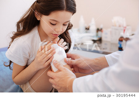 Nice pretty girl looking at her wound 30195444