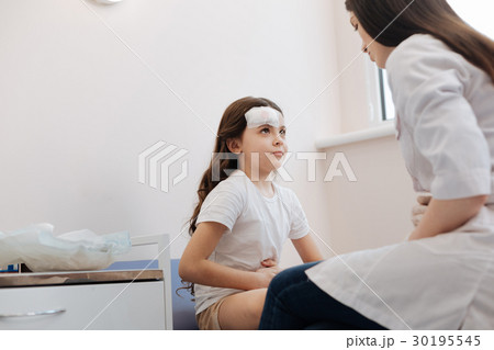 Cheerless sad girl having stomachache 30195545