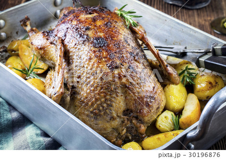 Roasted Duck with Potatoes, Apples and Quince  30196876