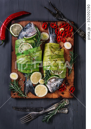 Still life with dorados wrapped in leek on the cut 30200290