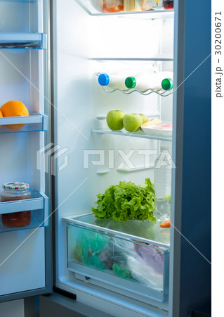 Open refrigerator full of food on kitchen 30200671