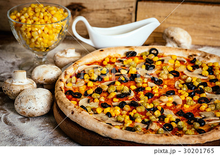 Pizza with chickpea, corn, olives and mushrooms 30201765