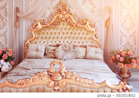 Luxury bedroom in light colors with golden 30201802