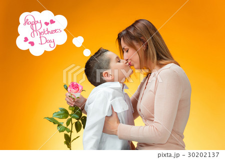 Young kid giving red rose to his mom 30202137
