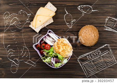 Bowl with salad standing near cheese sandwich 30203457