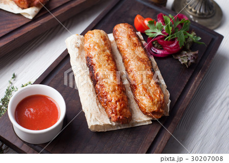 Kebab on wooden board with sauce still life on top 30207008