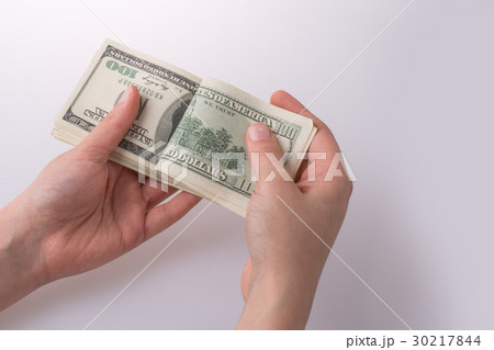 Human hand holding American dollar banknotes  30217844
