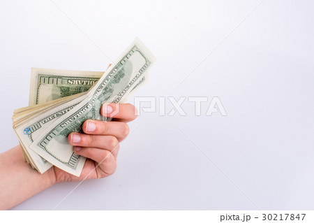 Human hand holding American dollar banknotes 30217847