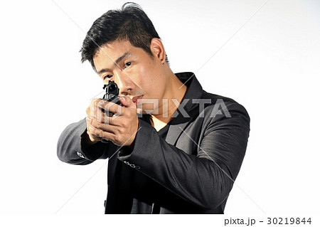 Man aiming gun. 30219844