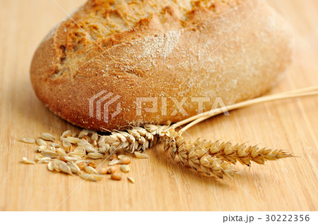 Freshly baked traditional bread on wooden board 30222356
