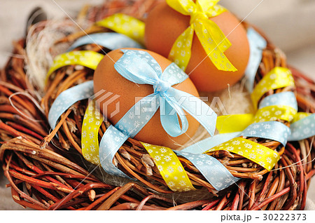 Easter eggs in the nest on a burlap Easter eggs in the nest on a burlap 30222373