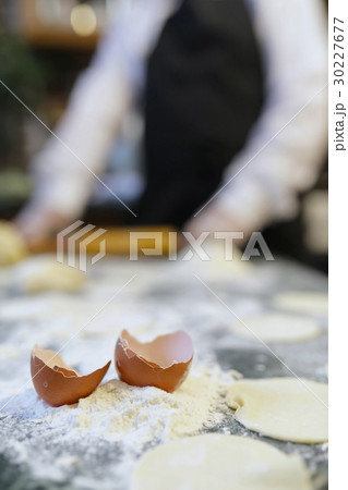 Male chef uses ingredients for preparing flour 30227677