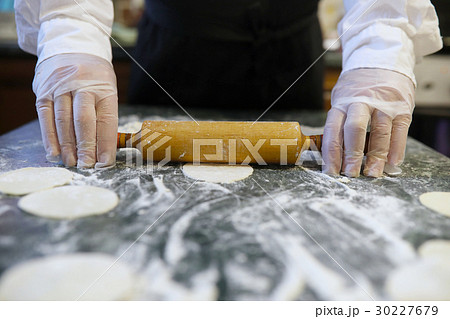 Male chef uses ingredients for preparing flour Male chef uses ingredients for preparing flour 30227679