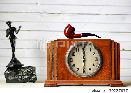 old clock and smoking pipe old clock and smoking pipe 30227837