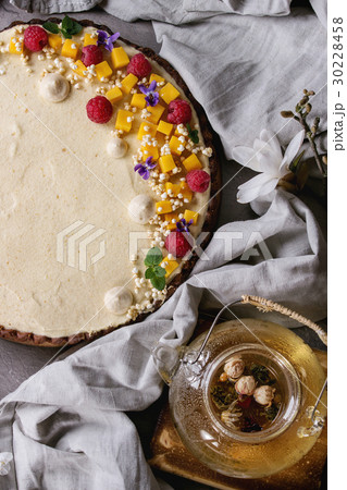 Chocolate tart with mango and raspberries 30228458