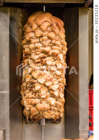 Shawarma grilling on spit 30235218