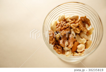 Glass bowl of mixed nuts Glass bowl of mixed nuts 30235819