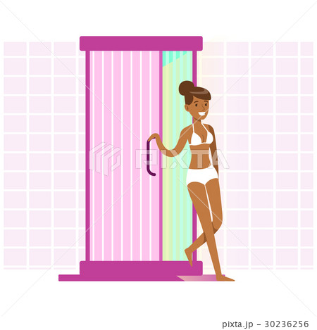 Attractive woman tanning in solarium. Colorful 30236256