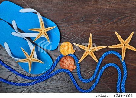 Flip-flops, starfish and seashells. Flip-flops, starfish and seashells. 30237834