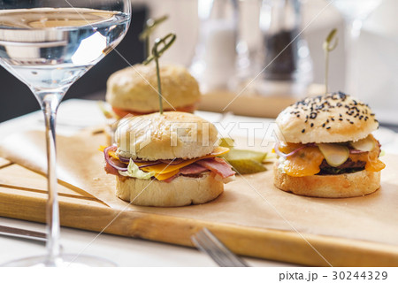 burgers with french fries 30244329