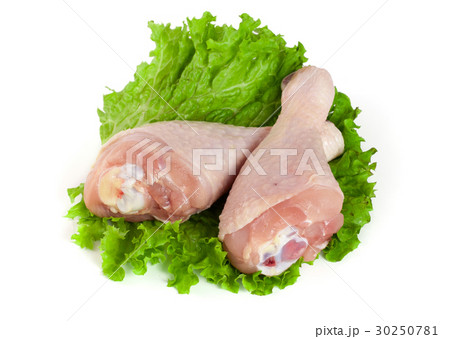 Two raw chicken drumsticks with lettuce leaf Two raw chicken drumsticks with lettuce leaf 30250781