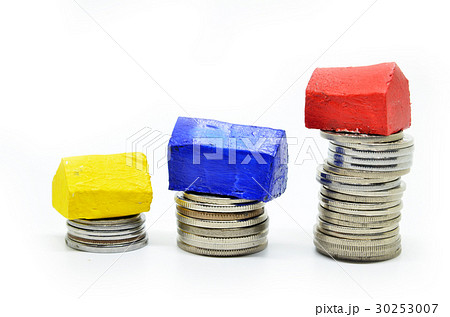 Coins stacked up in piles with color house Coins stacked up in piles with color house 30253007