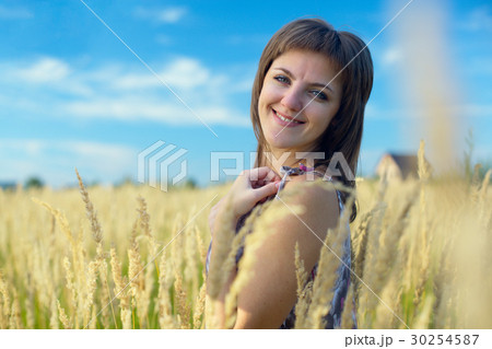 Woman in the grass 30254587