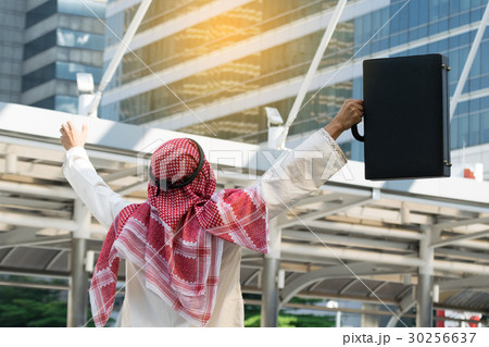 Arab businessman holding bag successful Arab businessman holding bag successful 30256637