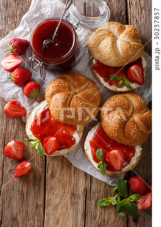 Buns for breakfast with strawberry jam, cream Buns for breakfast with strawberry jam, cream 30257857