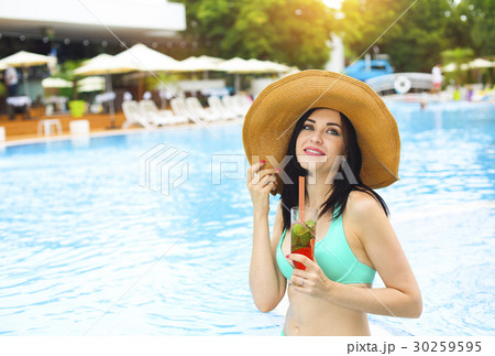 Real female  enjoying at swimming pool 30259595