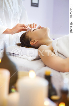 Woman with a deep cleansing face mask applied 30259596