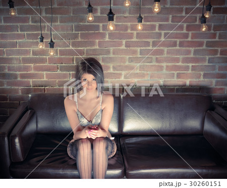 Young woman with a sexy body in underwear on sofa Young woman with a sexy body in underwear on sofa 30260151