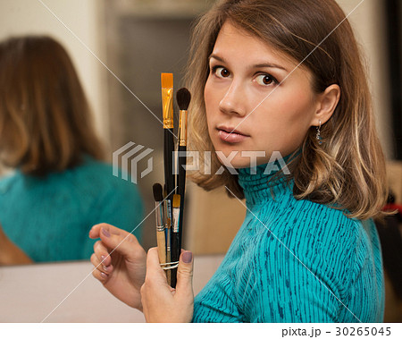 Girl holding brushes Girl holding brushes 30265045