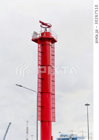 High red lighthouse in sea port High red lighthouse in sea port 30267510