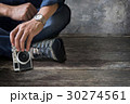 cropped image of man holding vintage camera 30274561