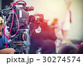 Video camera operator working with his equipment 30274574