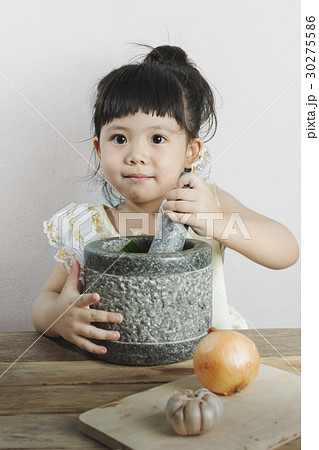 Asian Girls are cooking And happy on gray background. 30275586