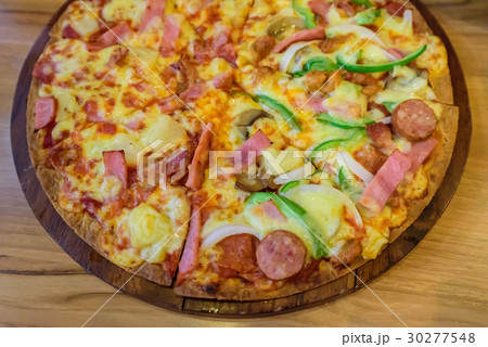 Yummy pizza on table Yummy pizza on table 30277548