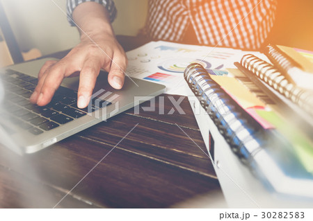 businessman hand working laptop on wooden businessman hand working laptop on wooden 30282583