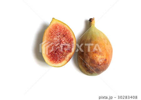 Cut through common fig fruit on white background. 30283408