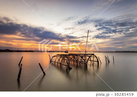 Trap basket on the sea shore. Trap basket on the sea shore. 30285459