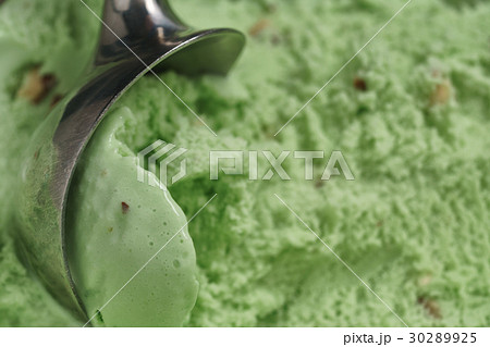 scooping natural pistachio ice cream closeup 30289925