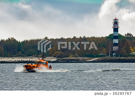 Orange pilot ship moving at speed Orange pilot ship moving at speed 30295767