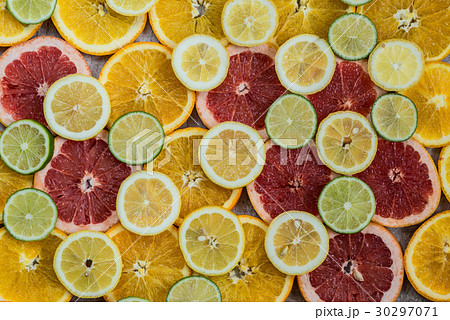 Citrus fruit background with sliced oranges lemons Citrus fruit background with sliced oranges lemons 30297071