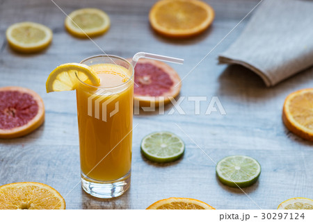 glass of orange juice on the wood background with glass of orange juice on the wood background with 30297124