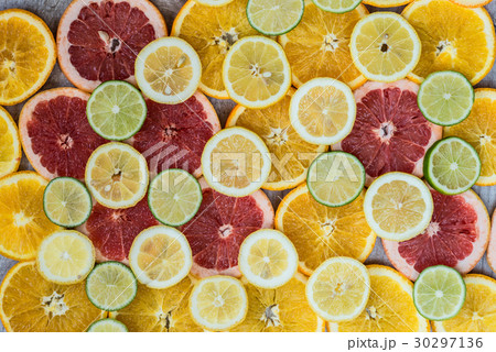 Citrus fruit background with sliced oranges lemons Citrus fruit background with sliced oranges lemons 30297136